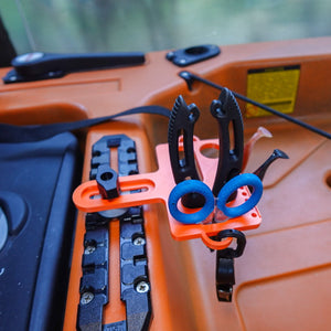 Close-up of kayak fishing tool holder mounted on T-rail.