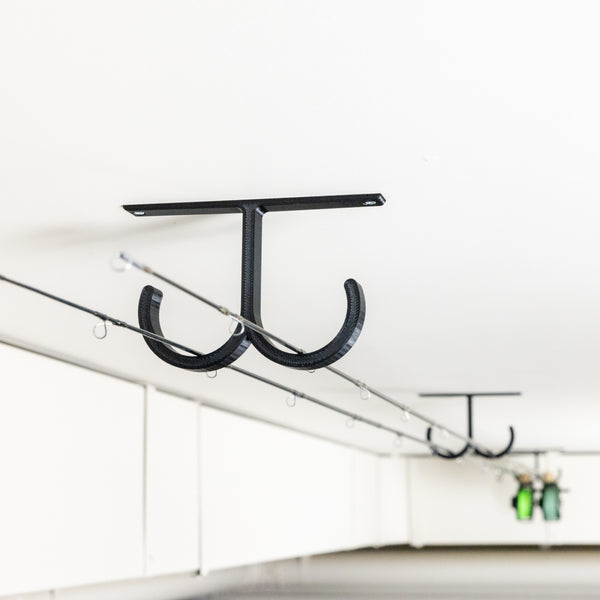 The Fishing Rod Holder Double Ceiling by Pesca Innovations allows you to store any of your fishing rods on a ceiling.