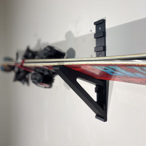 Close up of the ski holder attachment in use. The ski holder attachment slides in the Modular Rail which is sold separately.