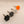 One knob in black, white, gray, and orange on a beige background
