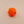 Orange plastic mounting knob on a beige background