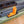Orange and black kayak rod holder on a green kayak