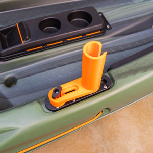 Orange and black kayak rod holder on a green kayak