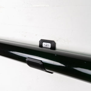 Black rod tube rack on a white wall with a visible brand logo.