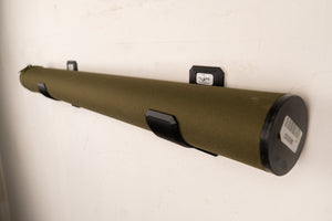 Green cylindrical object with black ends on a white background