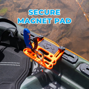 Orange kayak tool holder and magnetic pad attached to a green kayak with text 'Secure Magnet Pad' above.