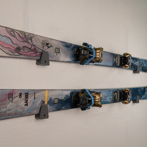 Two skis with bindings on a white background