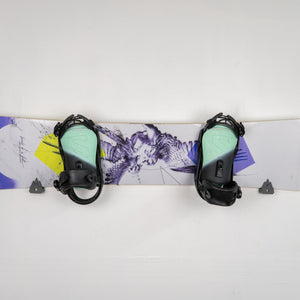 Snowboard with bindings on a white background