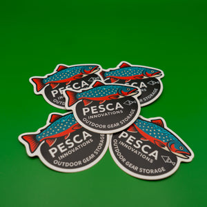 PESCA Innovations outdoor gear storage stickers with brook trout fish on a green background