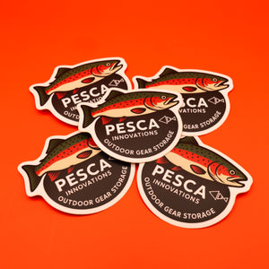 PESCA Innovations outdoor gear storage rainbow trout stickers on an orange background