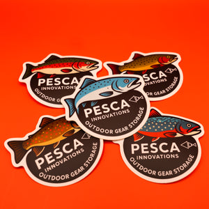 Pesca Innovations outdoor gear storage fish stickers on an orange background