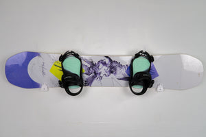 Snowboard with bindings on a white background