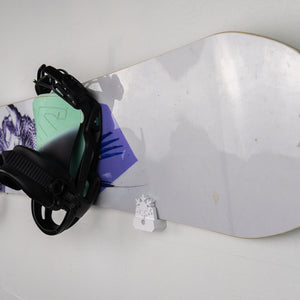 Snowboard with bindings on a white background