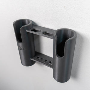 Gray fishing rod and tool holder on a light gray background