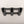 Black three-rod fishing rod holder on a light gray background