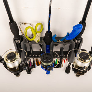 Fishing rod holder with multiple fishing rods and accessories on a white background