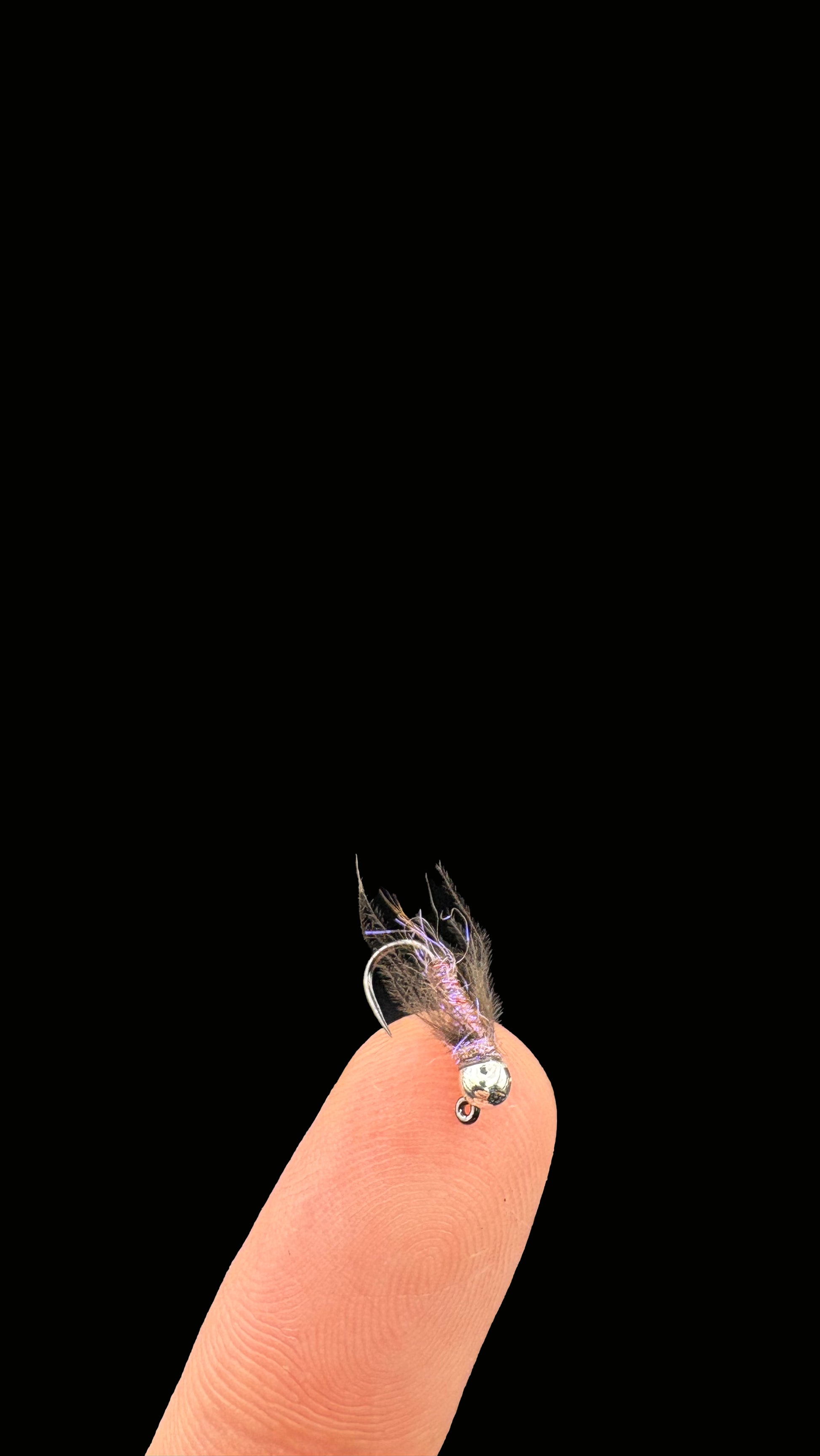 Duracell jig fly on the tip of a finger