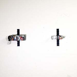 bottles on modular storage system bottle holders on white wall