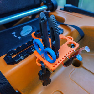 Orange kayak fishing tool holder with tools on it. 