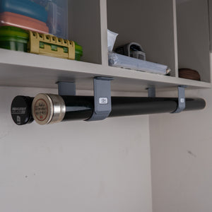 The Fly Rod Tube Holder Double Shelf by Pesca Innovations can hold any two fly rod tubes under a shelf.