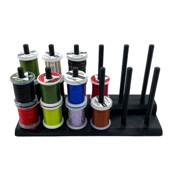 The Fly Tying Thread Holder for your Desk by Pesca Innovations is made of durable, lightweight, and weather resistant PETG.