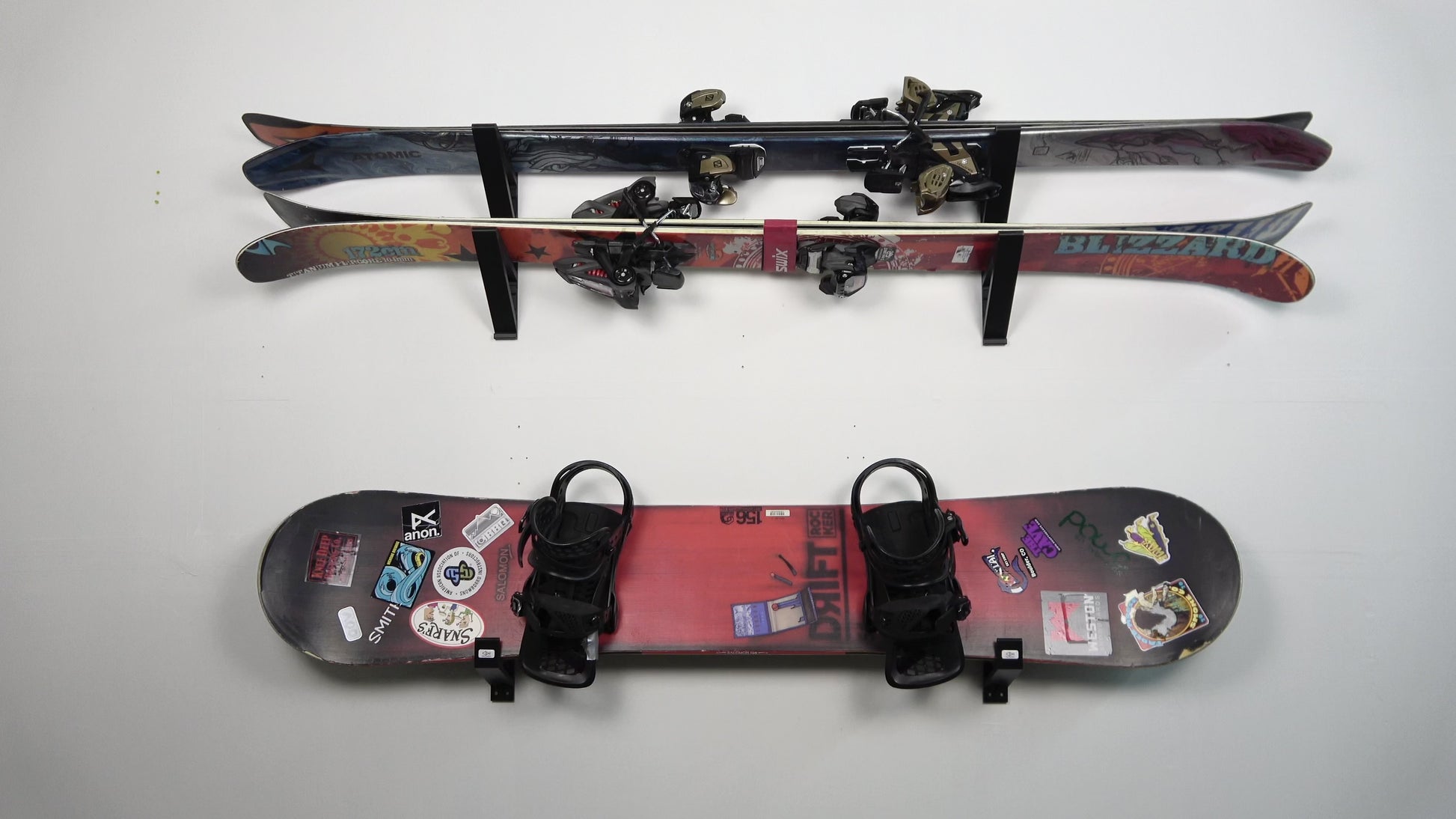 The Snowboard Holder Wall Mount by Pesca Innovations in use. 